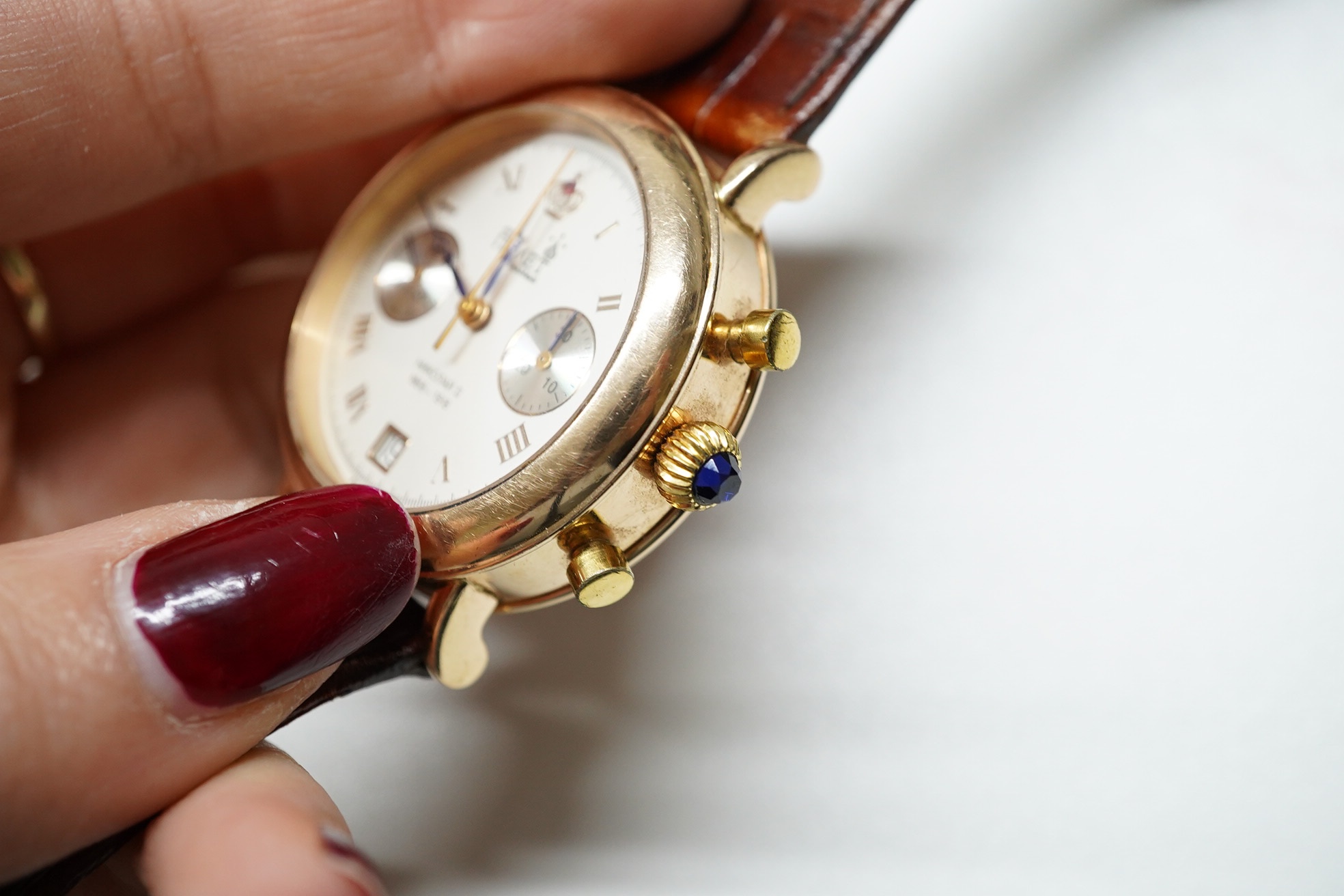 A gentleman's 1990's 14k Poljot International manual wind wrist watch, with Roman dial, date aperture and two subsidiary dials, case diameter 38mm, on an Apollo leather strap, with original certificate and box. Condition